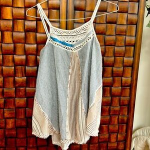 Boho tan and brown striped flowy tank with lace detail.